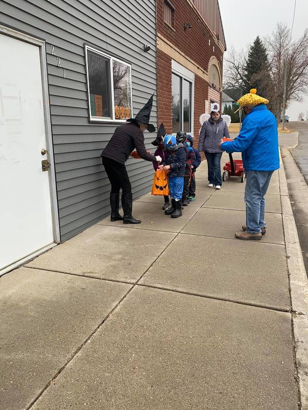 Students Trick-or-Treating down Main Street
